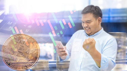 Bitcoin and blockchain concept, a gesture of ecstasy of a male businessman trading cryptocurrency bitcoin Bitcoin electronic money with price graphs and coin stacks