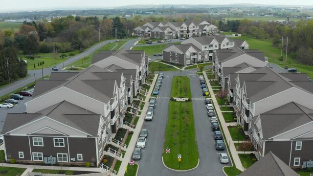 Aerial forward. Residential housing apartment buildings in USA. People live in rental units and condos in America.