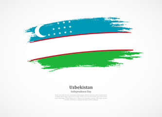 Happy independence day of Uzbekistan with national flag on grunge texture