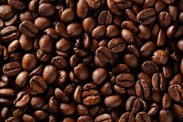 Food background of roasted coffee beans close-up. Flat lay.