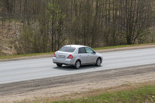 Ruzayevsky District, Mordovia, Russia - May 08, 2021: A rear view on Nissan Tiida sedan on the intercity road.