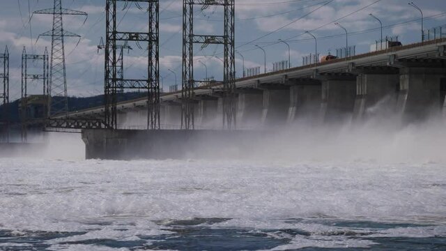 Hydroelectric power station on the Volga river. Large-scale construction with a road.