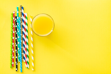 summer background bright color concept drink lemonade or juice cocktail straws color multicolored on the table healthy food meal snack copy space food background rustic. top view