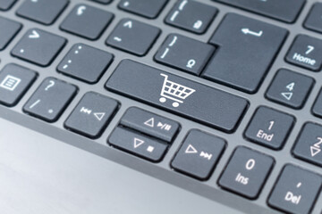 Online Shopping cart icon on keyboard key, e-commerce concept