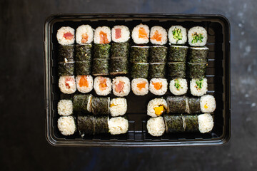 fresh sushi roll seafood multicolored maki susi salmon, tuna, rice, nori, wasabi, sesame asian food 