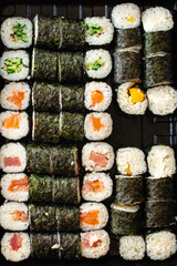 fresh sushi roll seafood multicolored maki susi salmon, tuna, rice, nori, wasabi, sesame asian food  © Alesia Berlezova