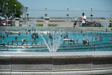 Fototapeta na wymiar splashes of a beautiful summer fountain