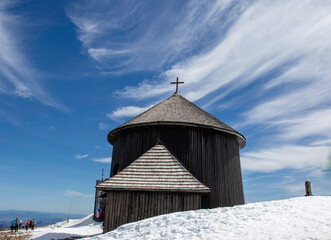 St. Lawrence's Chapel on Śnieżka. The wooden structure of the church is of a rotunda type, 14 meters high, built on a circular plan. There is a cross on the dome of the church