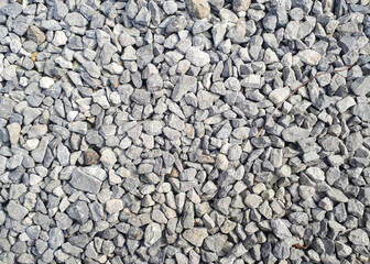 Obraz premium Gravel road texture. Small grey pebble patternt. Stone ground