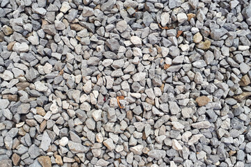 Gravel road texture. Small grey pebble patternt. Stone ground