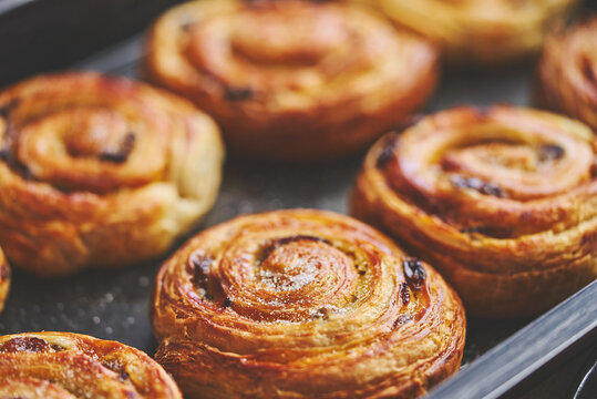 Freshly baked buns with cinnamon and spices. Close-up. Sweet baking concept