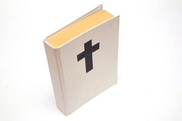White book with a cross on the cover