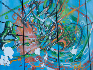 Abstract Painting on the Wall of a City with Green, Blue and Orange Colors