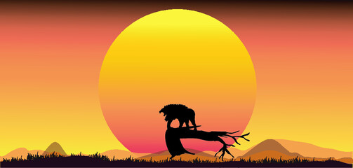 Fototapeta na wymiar Lion silhouette standing on tree, against sunset background.