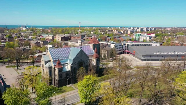 Liepaja, Latvia,Baltics. Beautiful 4K panoramic aerial video from flying drone to Liepaja city Martin Luther Evangelical Church  which is located by the Baltic Sea. (Series) 