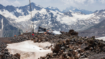 Panorama of the mountains of the Main Caucasian ridge. View from the southern slope of Mount Elbrus. Descent to the station by chairlift. Kabardino-Balkaria. Russia. July 2020.