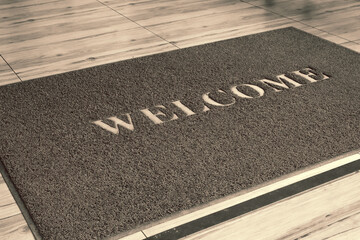 Welcome mat on wooden floor. - obrazy, fototapety, plakaty