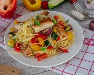 Healthy fish dinner with gluten free pasta and vegetables