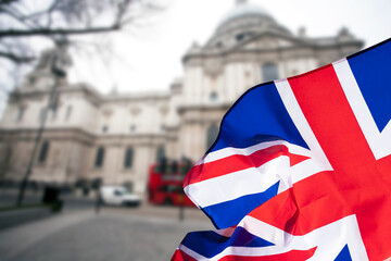 British union jack flag over icons of London