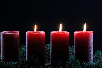 Natural advent wreath or crown with three burning red candles.  Christmas composition. .. France. - obrazy, fototapety, plakaty