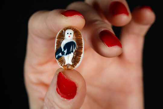 The King Cake a popular food item available beginning January 6, or Epiphany..Sometimes a tiny porcelain figure ( feve ) of a baby, baked with-in the cake. France.