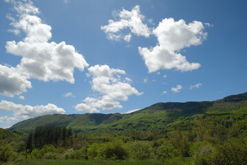 Fototapeta na wymiar Beautiful clouds over the mountains summer landscape