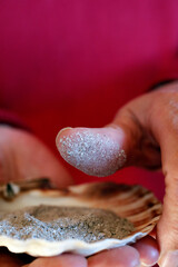 Close-up on hands and ashes.  Ash Wednesday celebration. Lent season. France.