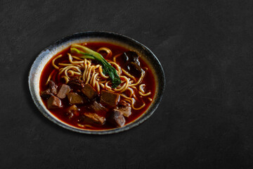 Homemade Chinese Beef Soup Lo Mein Noodles  On Concrete Table. 