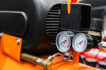 Fragment of a portable, gasoline compressor with pressure sensors. Close-up