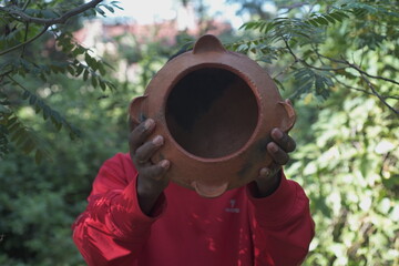 person holding a pot