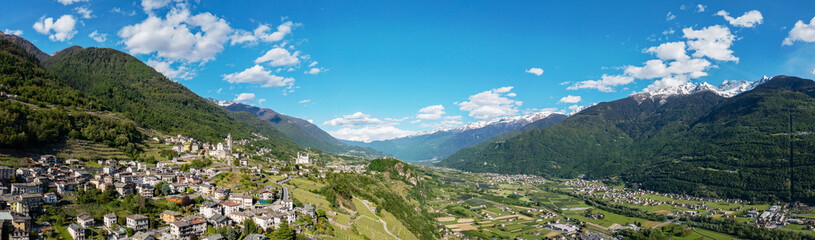 Fototapeta na wymiar aerial view of the village of Poggiridenti and the church of San Fedele in Valtellina, Italy