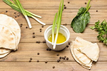Vegetarian snack. Pita with olive oil and greens. Sweet peas on table