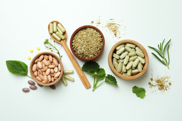 Concept of herbal medicine pills on white background
