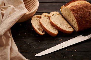 Homemade tartine bread on dark wooden table