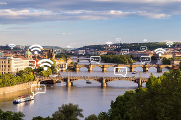 Fototapeta na wymiar Scenic view of old buildings and bridges over Vltava River in Prague, Czech Republic at day. Wireless network connection, WiFi, smart city and online messaging concept.