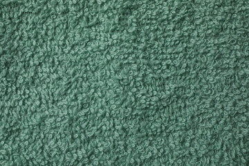 Clean green towel on whole background, close up