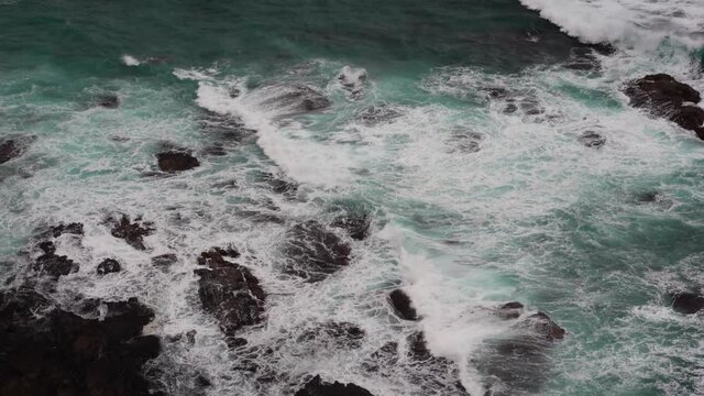 Calming Footage of beautiful blue ocean waves crashing the rocky shore at Loch Ard Gorge 12 Apostles Coast and Hinterland Port Campbell