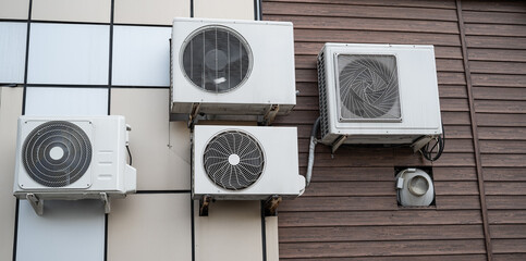 Industrial air conditioners on the wall.