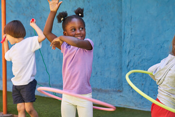 African girl doing gymnastics with hoops