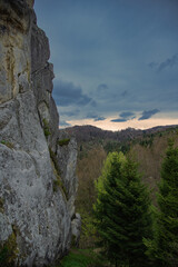 High perspective view of the mountains during sunset. Some mountain peaks. The concept of landscape and nature.