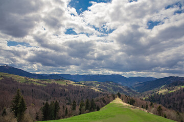 High perspective view of the mountains during sunset. Some mountain peaks. The concept of landscape and nature.