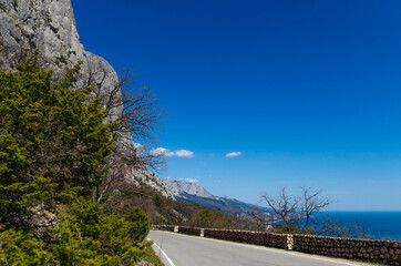 Picturesque mountain view with sea views. A winding road in the mountains, Crimea. Travel and vacation concept.