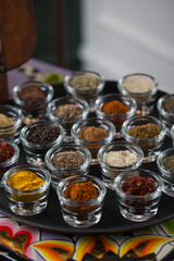Colorful spices in small bowls
