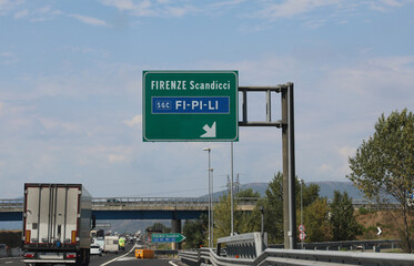 Italian road signs motorway with directions to reach the cities of Florence and Scandicci and the...