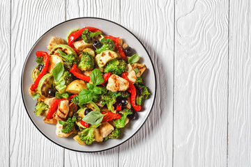 Vegetable and chicken roast on a plate, copy space