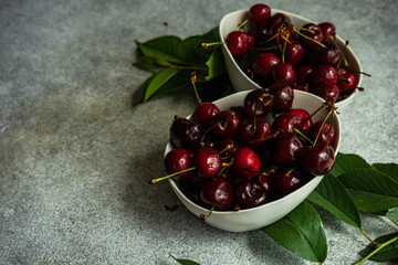 Sweet cherries on concrete background