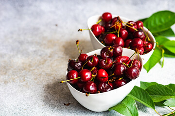 Sweet cherries on concrete background