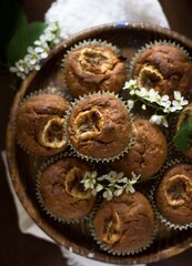 banana muffins in a plate on a wooden background in rustic style. Viennese cookies with berries. proper nutrition, organic food, healthy food, seasonal food, festive, holidays, children's concept.