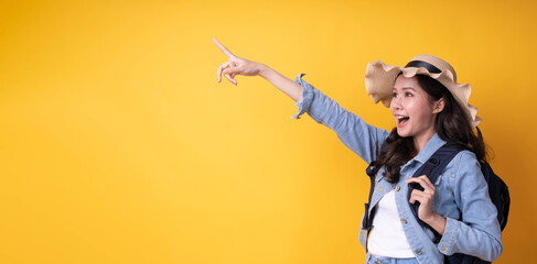 Nice looking Asian female traveler with suitcase and hats to travel during the holidays. backpacker and go to travel in weekend concept