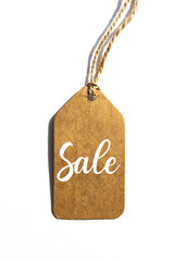 Brown tag on white background. Top view, copy space. Hang tag with text 